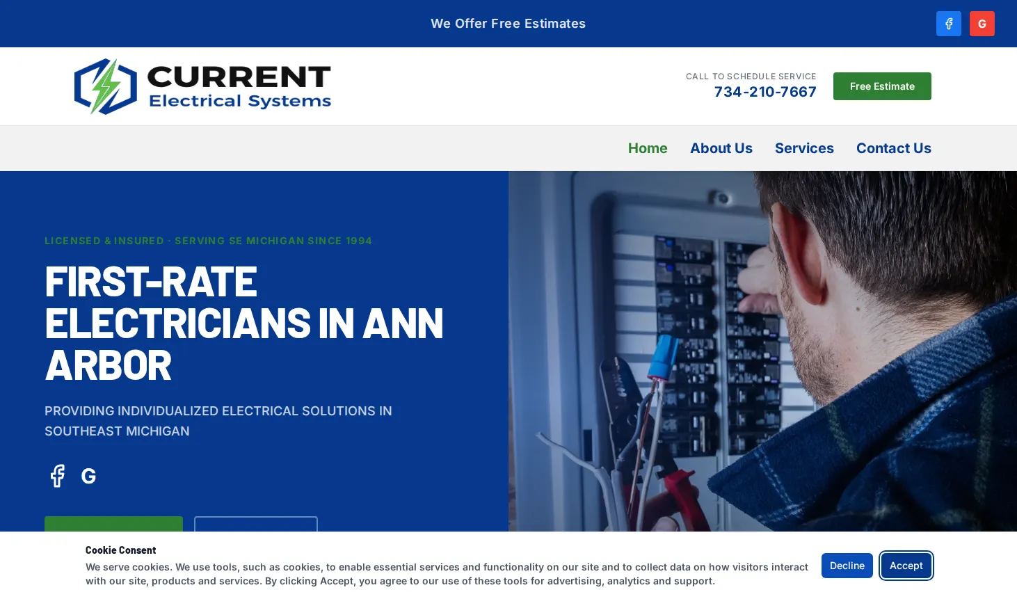 The old Current Electrical Systems GoDaddy homepage: a large headline, a stock photo of an electrician at a panel and a cookie banner across the bottom
